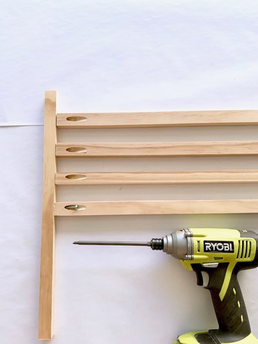 Wood dowels and drill for modern towel rack DIY