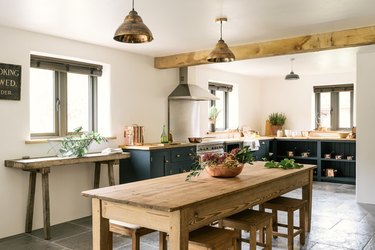 Country kitchen window with Venetian blinds and exposed wood beam