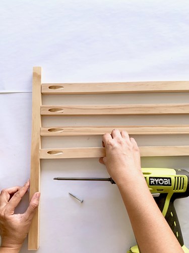 Placing wood dowels together for towel rack DIY