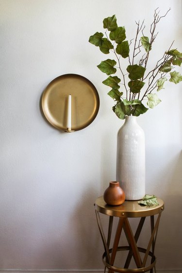 DIY home decor idea for your living room with brass serving platter