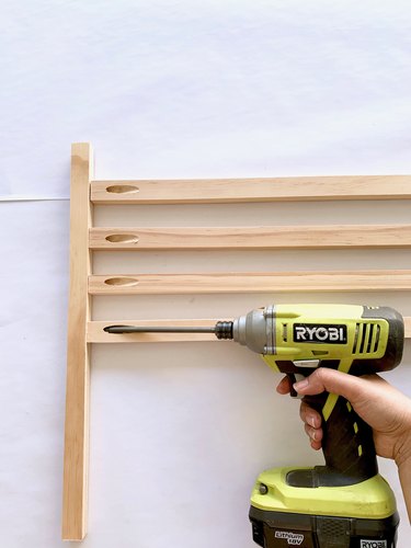 Wood dowels and drill for modern towel rack DIY