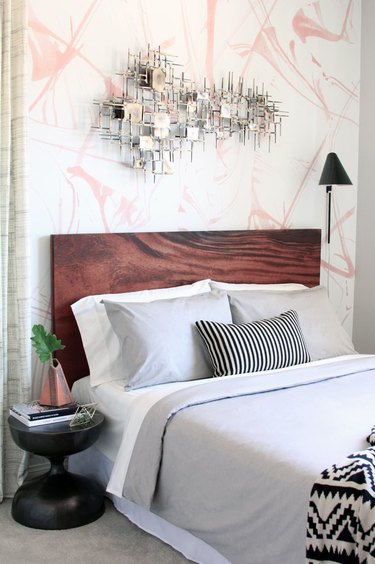 bedroom wall decor idea with abstract art and wallpaper