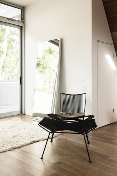 High ceilings and black chair, natural light