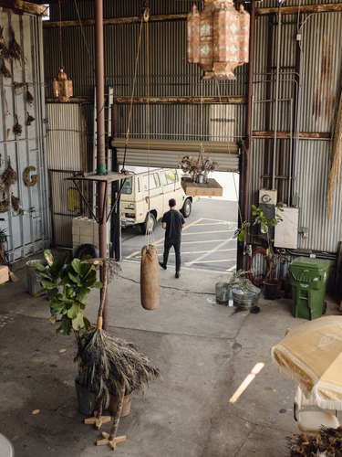 Spencer Falls walks in the entrance of his studio