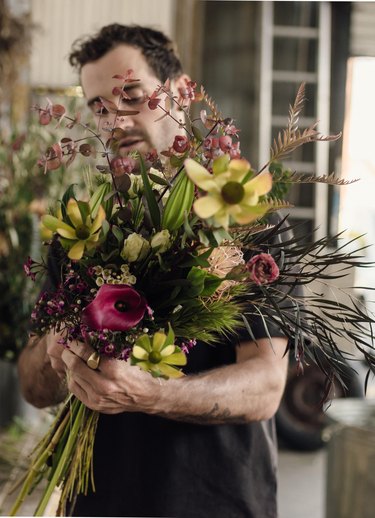 Spencer Falls designs a floral bouquet