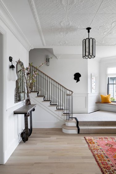 muted entryway with traditional staircase