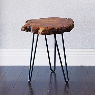 Small wooden live edge end table with black metal legs