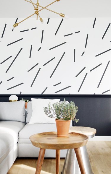 black-and-white living room idea with wainscoting and patterned wallpaper