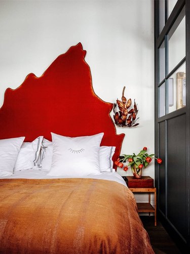 colors that go with red in a white bedroom with red headboard and orange throw blanket