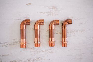 Male adapters attached to small pipes