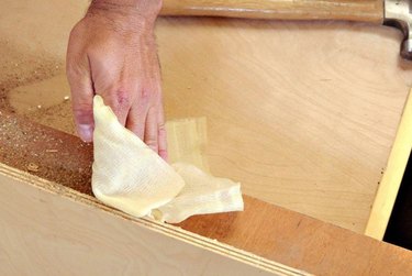 Dad Uses Tack Cloths After Sanding to Ensure a Smooth Finish 