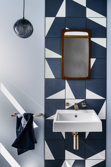 bathroom backsplash idea with geometric tile pattern and floating sink