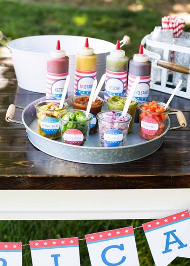 Condiments and toppings on an aluminum tray