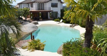 sand pool in front of a house