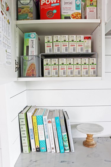 small kitchen organization idea with risers in cabinet