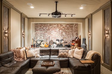 Fathers Day man cave idea with brick accent wall and stage for performing instruments