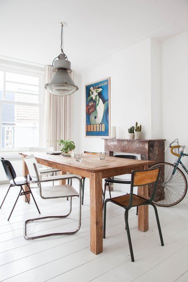 dining room with rustic table and mismatched chairs