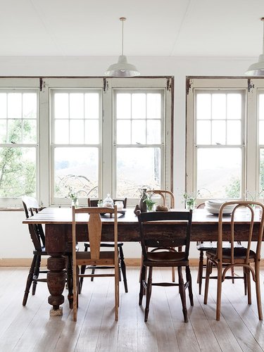 rustic dining table with mismatched chairs