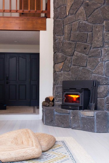 The two story stone fireplace in the family room.