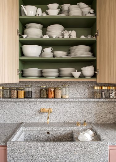 modern kitchen backsplash idea with gray terrazzo countertops and open shelving