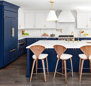 navy cabinets kitchen trend in 2019 with white cabinets and marble backsplash