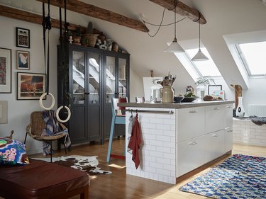 attic kitchen with black cabinet