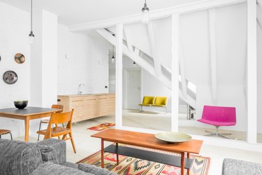 white attic kitchen with colorful furniture