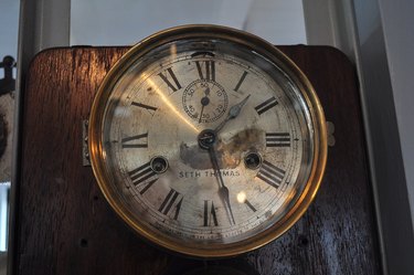 a tarnished Seth Thomas wall clock in the Virginia V historic ship's engine room