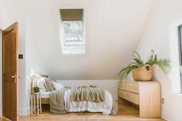 attic skylight designs in bedroom with sloped ceiling