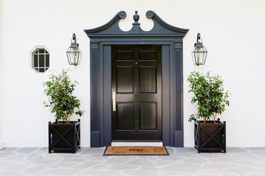 exterior door trim on black front door with extravagant navy trim