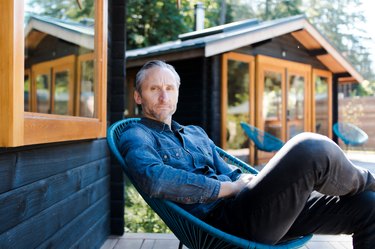 Jesse Keefer sits on a porch at Bodega Cove