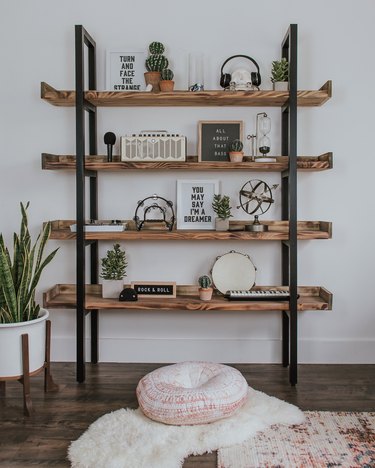 diy industrial bookshelf with black ladder detail