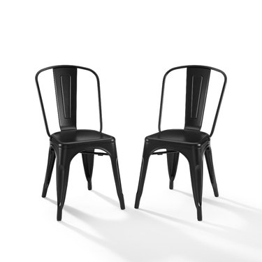 Industrial furniture, World Market dining chairs in black metal with vintage visuals