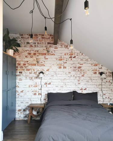 whitewashed brick wall industrial wallpaper in a bedroom
