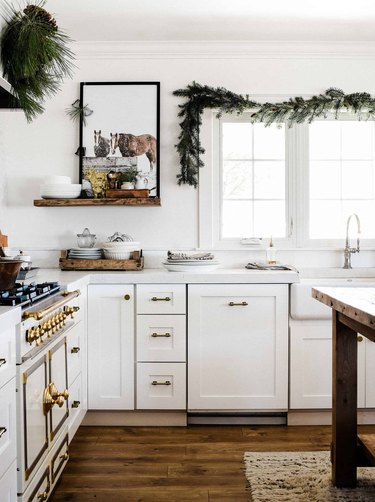 white kitchen with Christmas window decorations