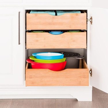 small kitchen organization idea with roll out drawers in the cabinet