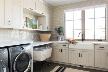 Champagne color painted laundry room by Studio McGee