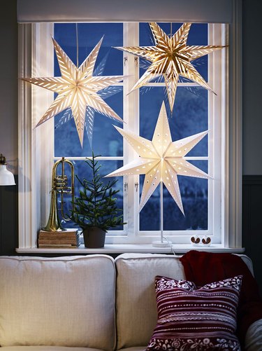 blue window with star light lantern Christmas window decorations