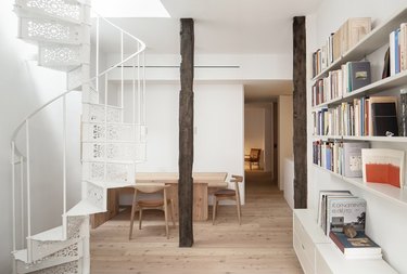 staircase, table with chairs, and bookcase