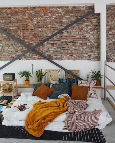industrial style apartment bedroom with X-brace wall support
