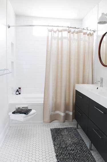 bathroom with black vanity cabinet