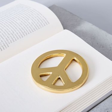 brass peace sign paperweight