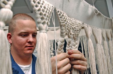 Sailor doing macrame