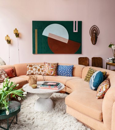 pink maximalist living room with pink sofa