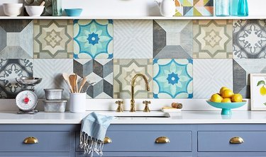 patterned wood floor tile kitchen backsplash with blue cabinets