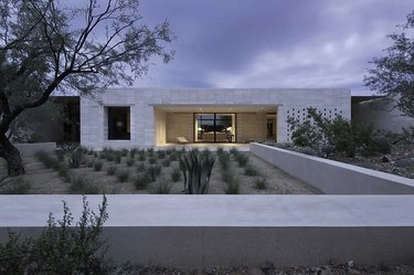 Stone for house exterior with stacked limestone walls and outdoor greenery