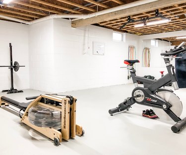 basement gym with wood rafter ceiling