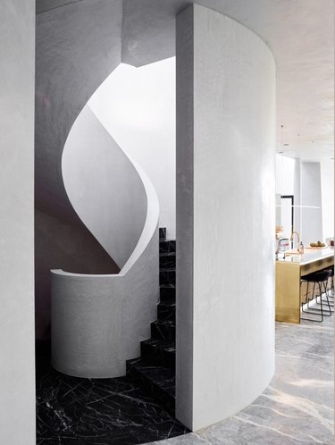 marble and plaster curvilinear black and white stairs