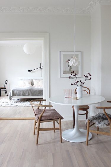 Scandinavian dining room with sheepskin seat cover