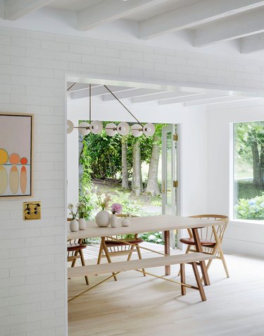 Scandinavian dining room with dining chairs and bench